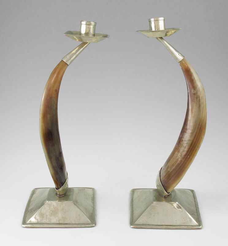 Appraisal: PAIR AIREDELSUR HORN CANDLESTICKS Silver metal known as Alpaca Silver