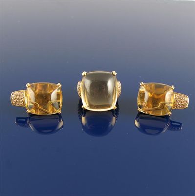 Appraisal: A cabochon citrine and diamond set gold ring With matching