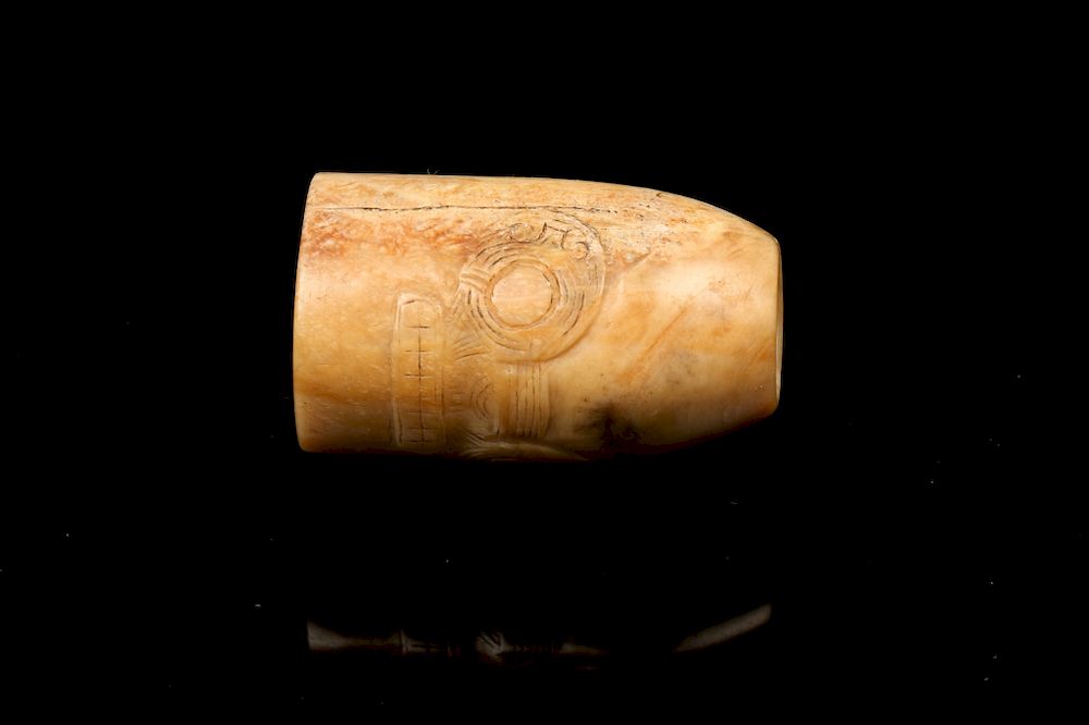 Appraisal: JADE MASK CARVED TUBULAR LONGSHAN BEAD Of a cylindrical form