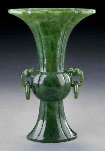 Appraisal: Chinese carved spinach jade Gu vase with two dragon handles