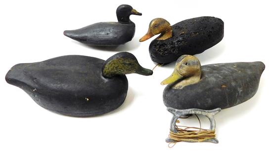 Appraisal: DECOYS Four early to mid- th C floating duck decoys