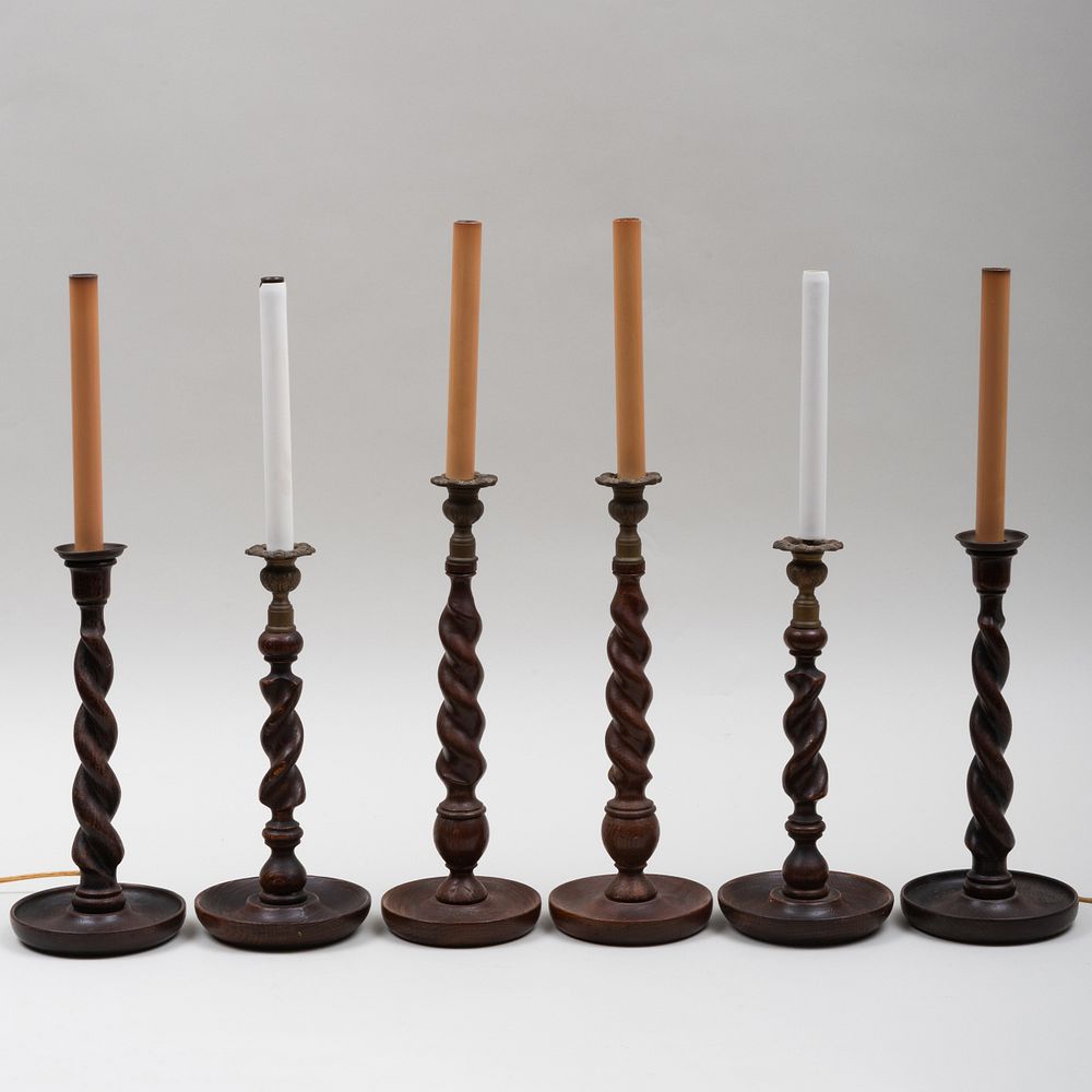 Appraisal: Three Pairs of Barley Twist Oak Candlestick Lamps The largest