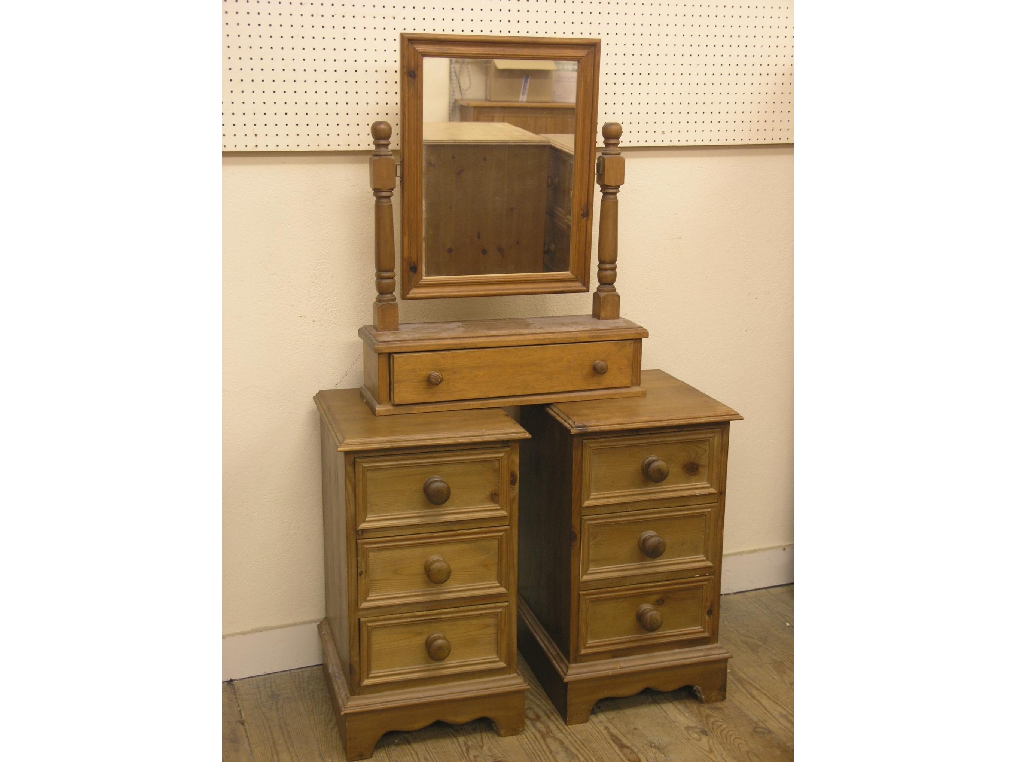 Appraisal: A pair of waxed pine bedside chests each with three