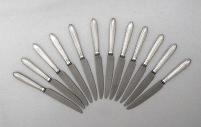 Appraisal: Eleven George III side knives with reeded bright cut handles