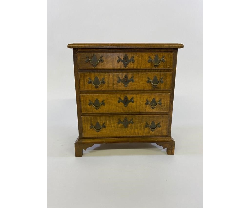 Appraisal: Miniature Chippendale style tiger maple chest of drawers th c