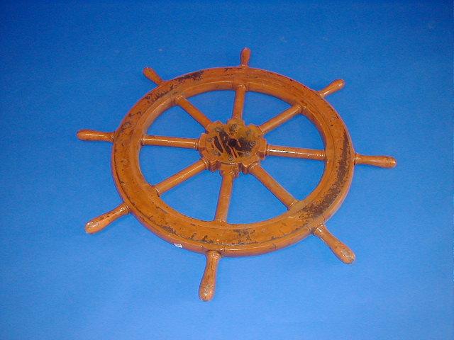 Appraisal: A ship's wheel and three saddle hooks