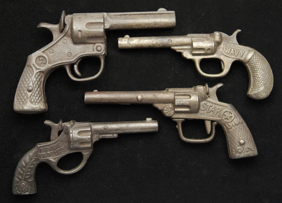 Appraisal: LOT OF FOUR CAST IRON CAP GUNS To include a