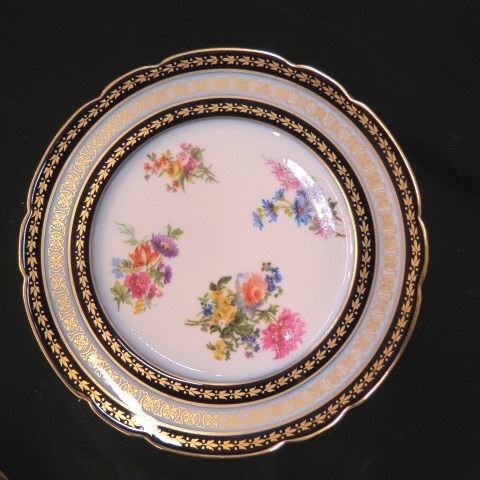 Appraisal: Limoges Porcelain Plates floral bouquets with cobalt gold borders excellent