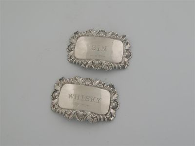 Appraisal: Two modern labels oblong form with shell and scroll borders