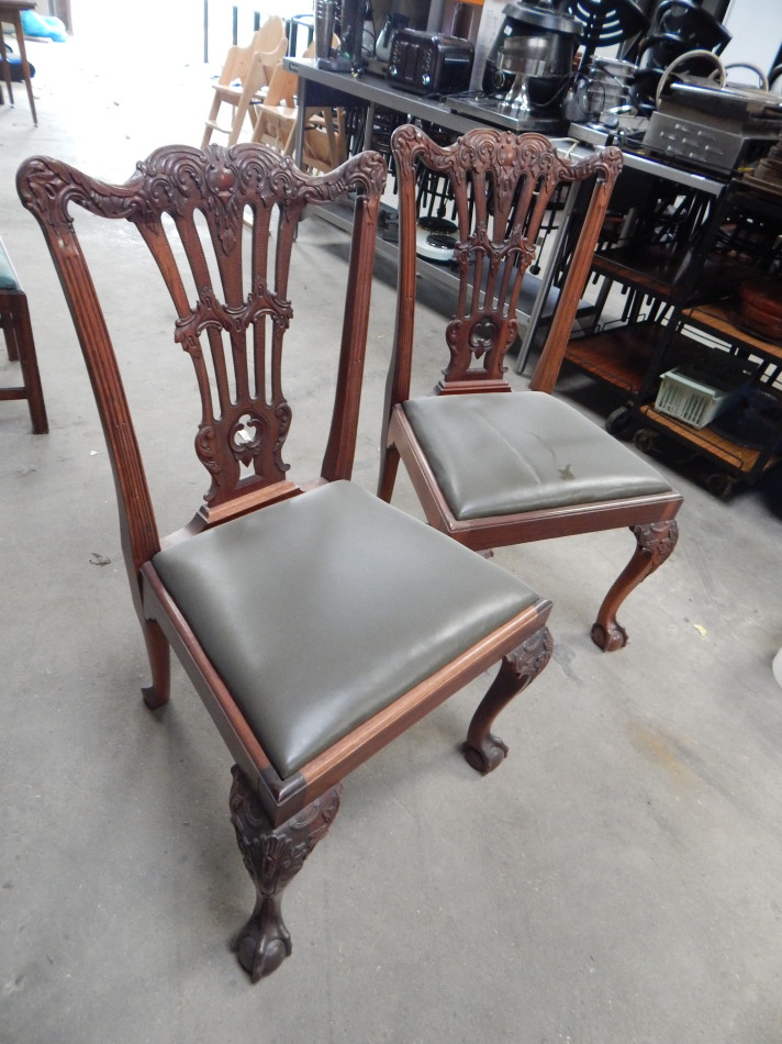 Appraisal: A pair of Chippendale revival mahogany finish boardroom chairs each