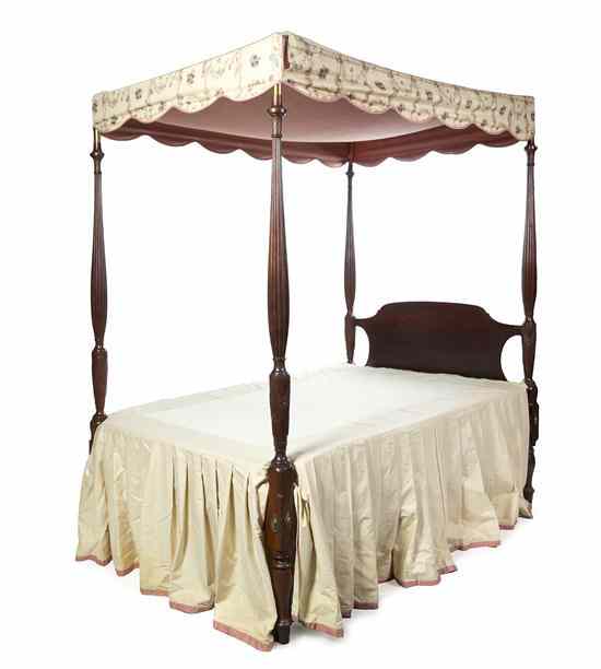 Appraisal: An American Mahogany Canopy Bed having four reeded and turned