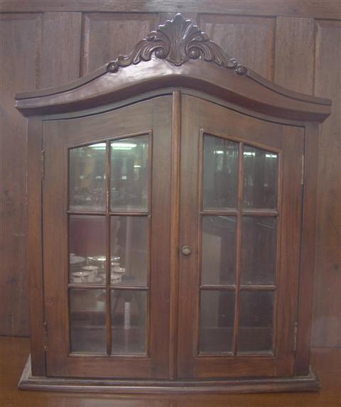 Appraisal: CHIPPENDALE STYLE MAHOGANY HANGING SHELF with scrolled arched pediment two