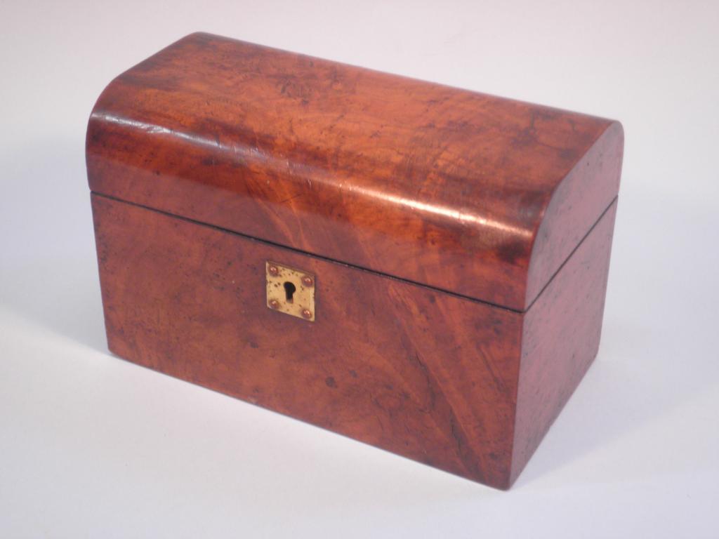 Appraisal: A Victorian figured walnut tea caddy with a domed lid