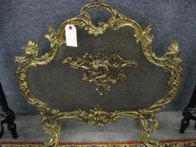 Appraisal: Ornate French Style Brass Firescreen rococo design wire mesh footed