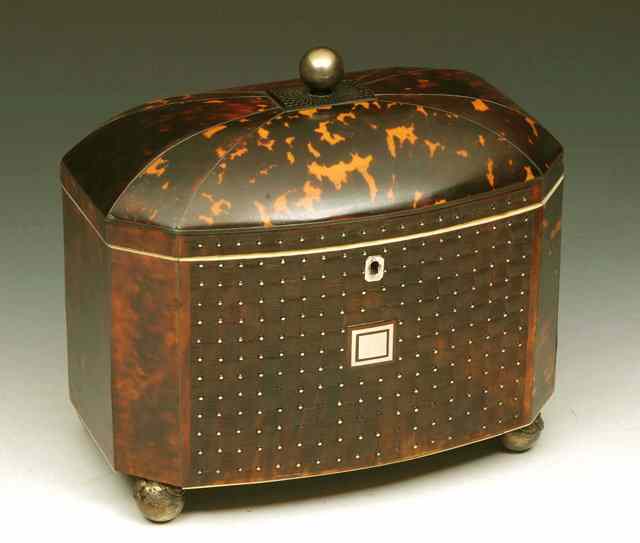 Appraisal: A GEORGE IV TORTOISESHELL TEA CADDY with bow front and