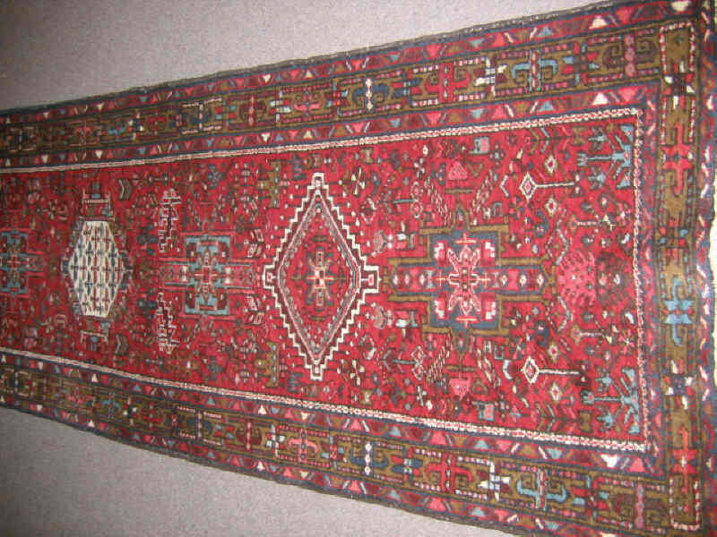 Appraisal: KARAJA HALL RUNNER The red field of angular floral motifs