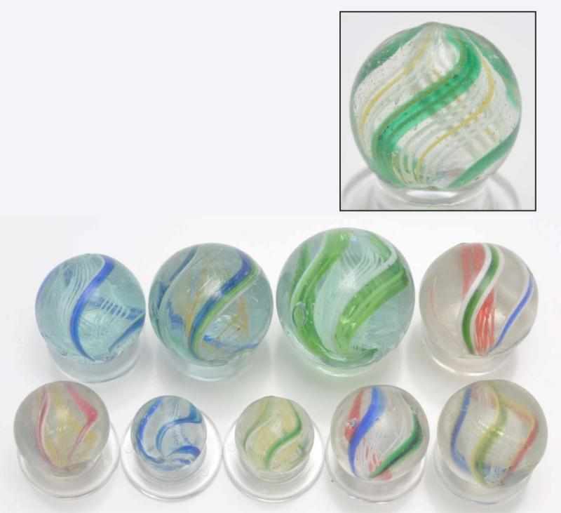 Appraisal: Lot of Latticino Swirl Marbles Description Includes nine divided core