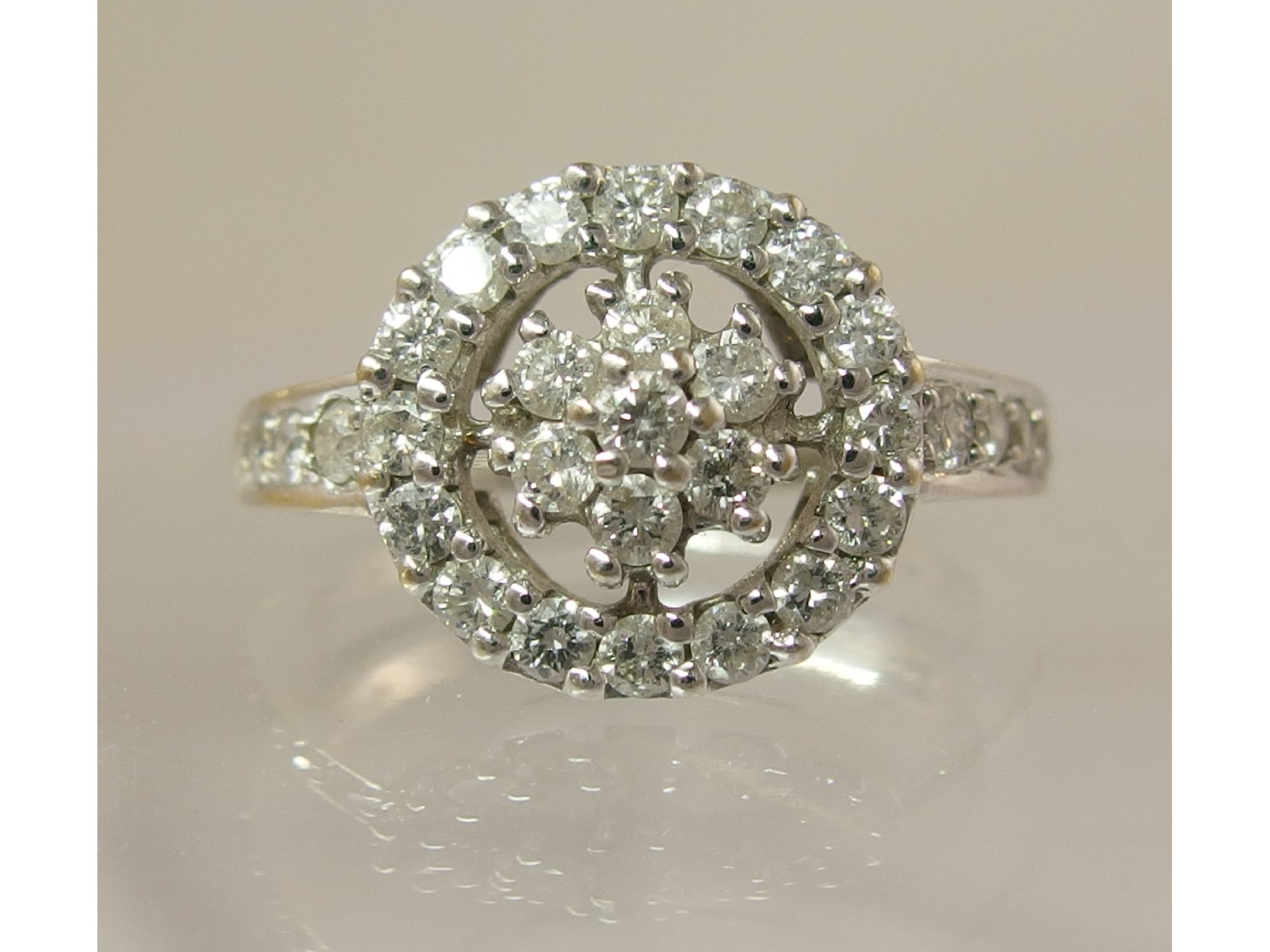 Appraisal: An ct white gold diamond flower cluster ringa diamond flower