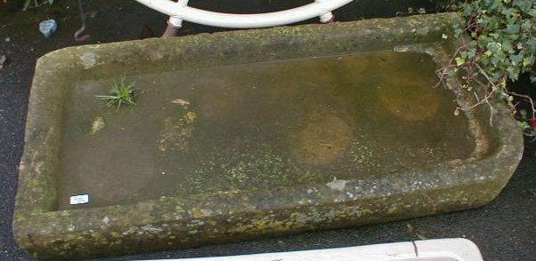 Appraisal: A hand hewn stone sink