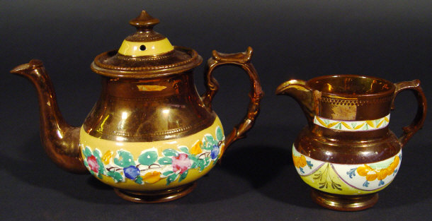 Appraisal: Victorian copper lustre teapot and a similar Dutch style jug