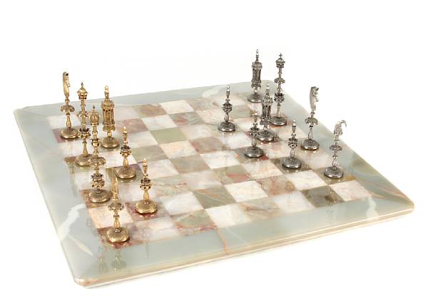 Appraisal: A marble chess board together with a boxed set of