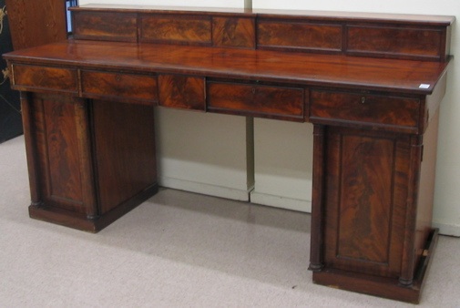 Appraisal: AN EMPIRE MAHOGANY DOUBLE PEDESTAL SIDEBOARD English second quarter of