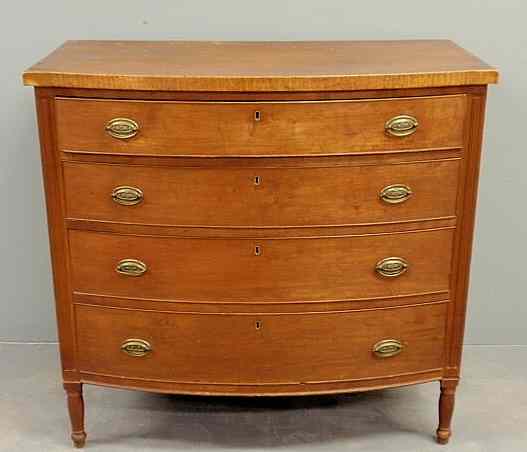 Appraisal: Sheraton cherry bow-front chest of drawers with tiger maple banding