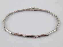 Appraisal: A white metal tests carat gold articulated diamond bracelet estimated