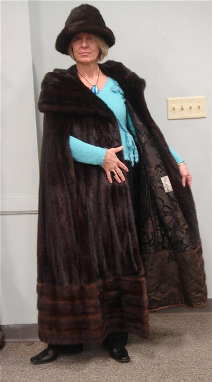 Appraisal: Full length brown mink cape zippered extension around bottom about