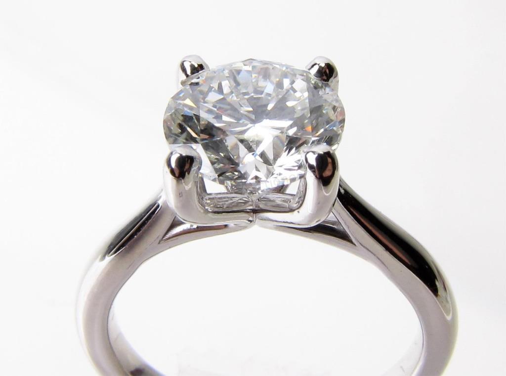 Appraisal: A K white gold ring with a ct round brilliant