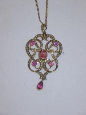 Appraisal: AN EDWARDIAN PINK STONE AND SEED PEARL PENDANT BROOCH of