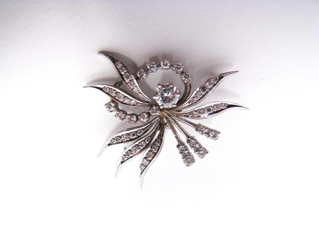 Appraisal: k white gold diamond spray pin with ct center stone