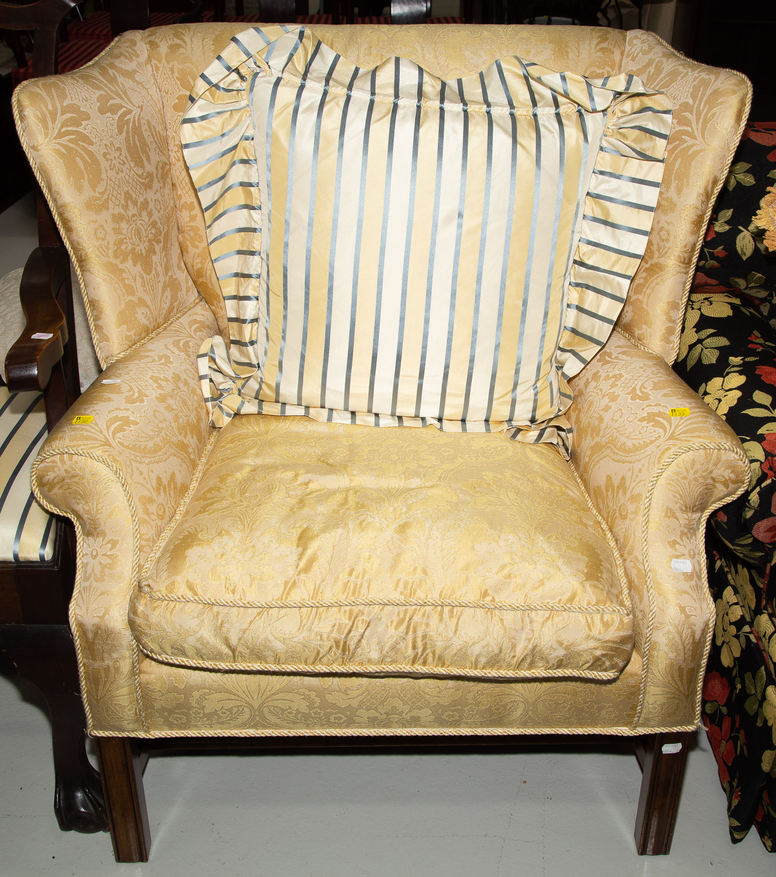 Appraisal: CHIPPENDALE STYLE WINGBACK CHAIR Modern with beech frame and damask