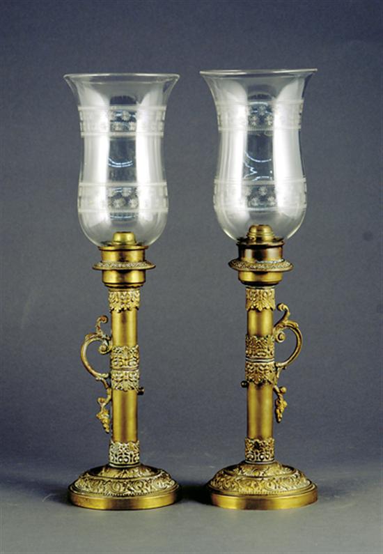 Appraisal: Pair brass and crystal candlesticks etched hurricane shade on leaf-decorated