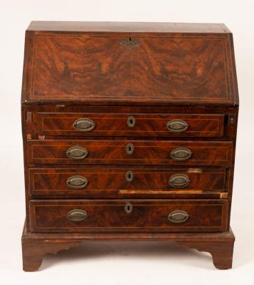 Appraisal: An th Century walnut bureau the fall enclosing an interior