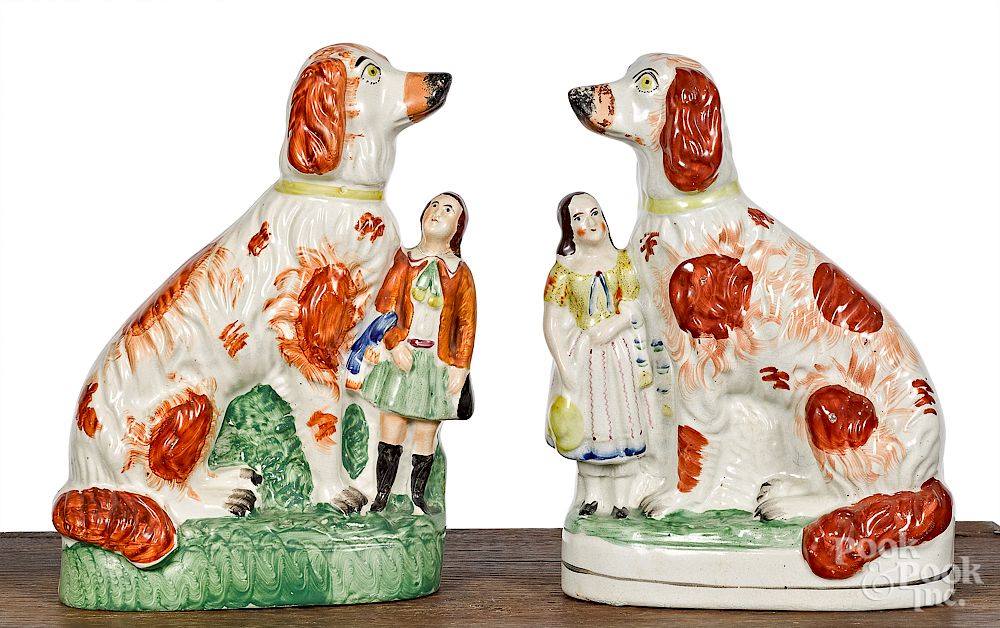 Appraisal: Pair of Staffordshire spaniel and child groups Exclusive on Bidsquare