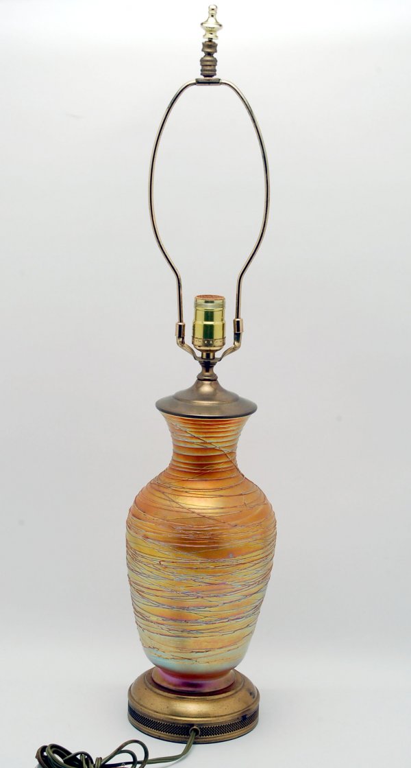 Appraisal: Marigold opalescent art glass vase mounted as a lamp circa