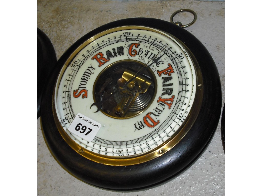 Appraisal: Carved oak circular aneroid barometer with open dial