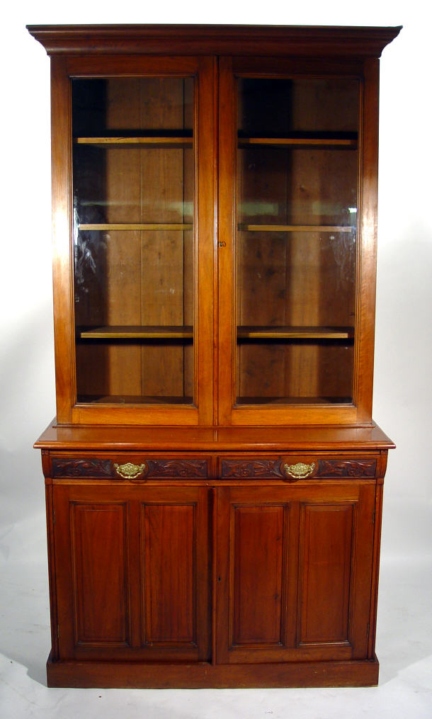 Appraisal: Victorian walnut bookcase the moulded cornice above a pair of