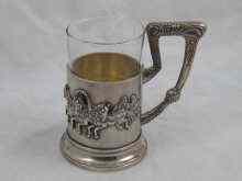 Appraisal: A large Russian silver tea glass holder in the pan