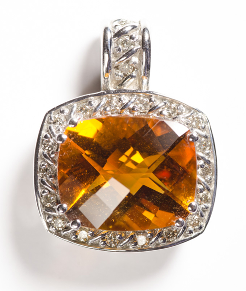 Appraisal: CITRINE DIAMOND AND TEN KARAT WHITE GOLD PENDANT with round-cut