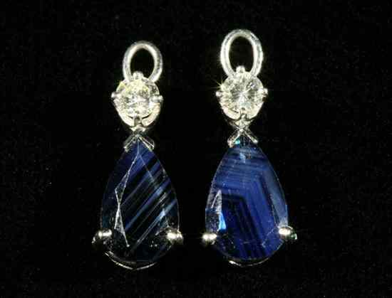 Appraisal: PAIR WHITE GOLD DIAMOND AND SAPPHIRE POST-BACK EARRING ENHANCERS Each