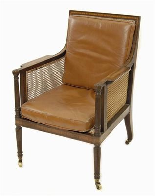 Appraisal: A late th century mahogany bergere armchair satinwood banding and