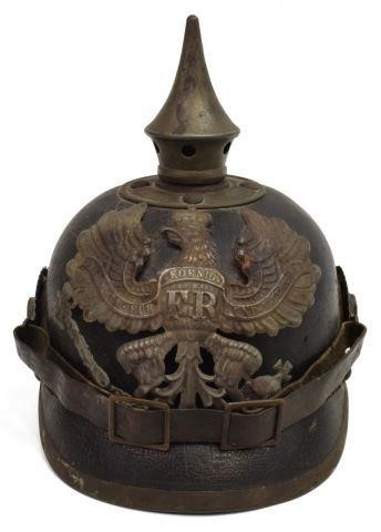 Appraisal: German pickelhaube helmet fitted with metal front plate depicting the