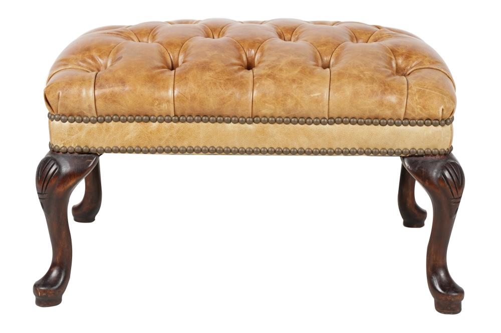 Appraisal: TUFTED LEATHER OTTOMANon carved wood legs inches wide inches deep