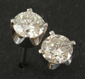 Appraisal: A pair of diamond stud earrings Each round brilliant cut