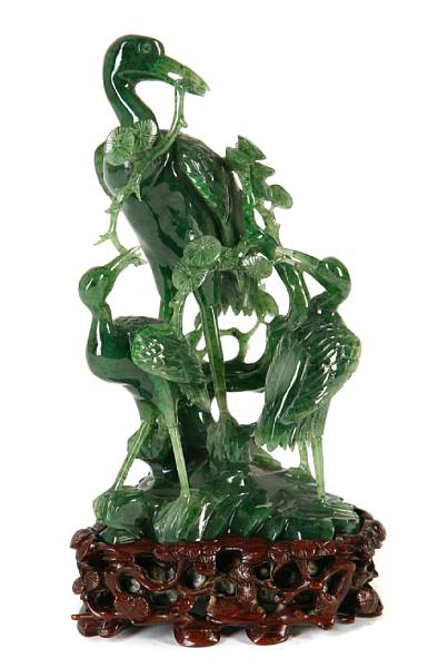 Appraisal: A contemporary carved spinach jade figure of two cranes leg