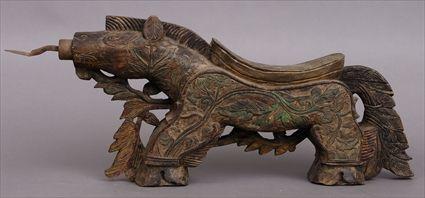 Appraisal: INDONESIAN POLYCHROME CARVED WOOD COCONUT GRATER The zoomorphic body decorated