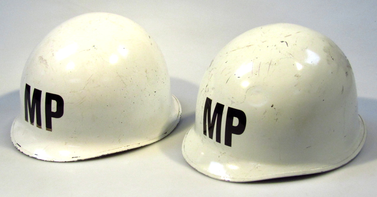 Appraisal: A pair of thC tin helmets each marked NP to