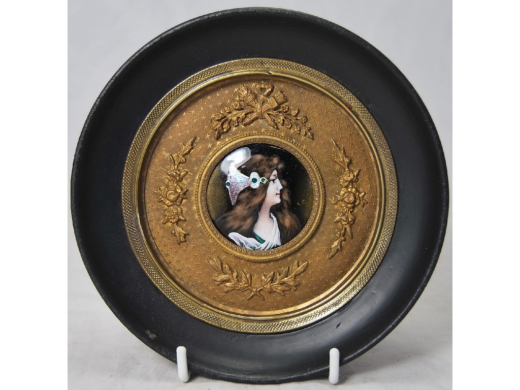 Appraisal: A circular Limoges enamel plaque painted with a young woman